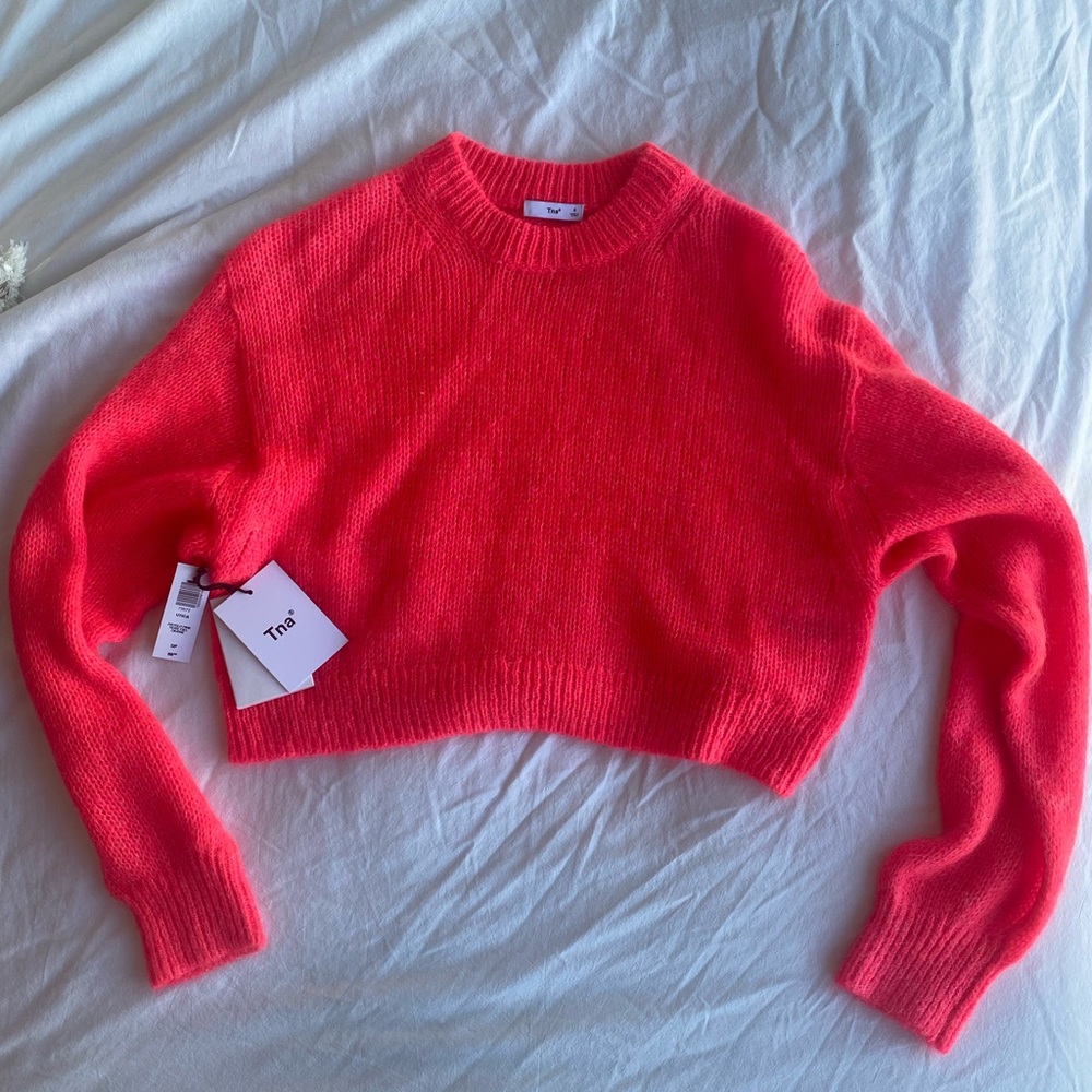 Dayglo pink TNA cropped sweater from Aritzia